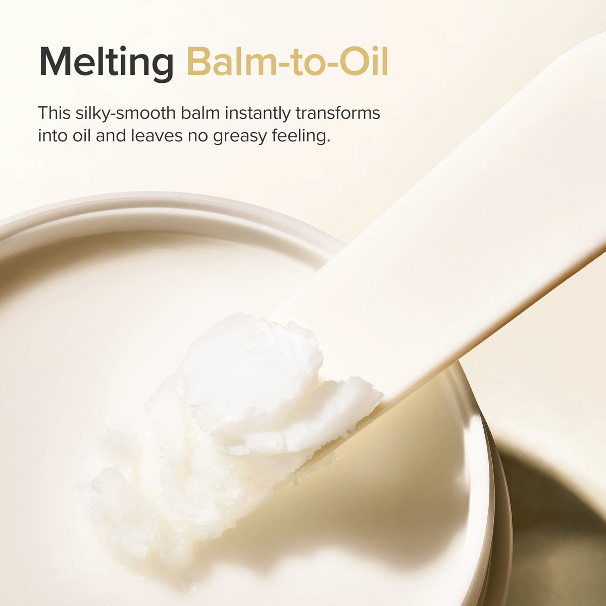 Cleansing balm on a scoop above an open jar