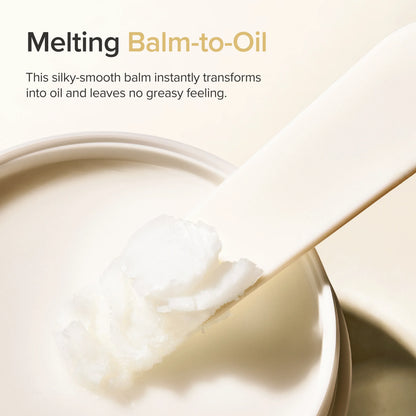Cleansing balm on a scoop above an open jar